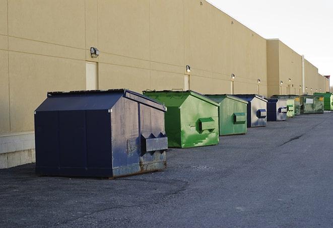 portable, green construction dumpsters serving as a container for scrap materials in Azusa